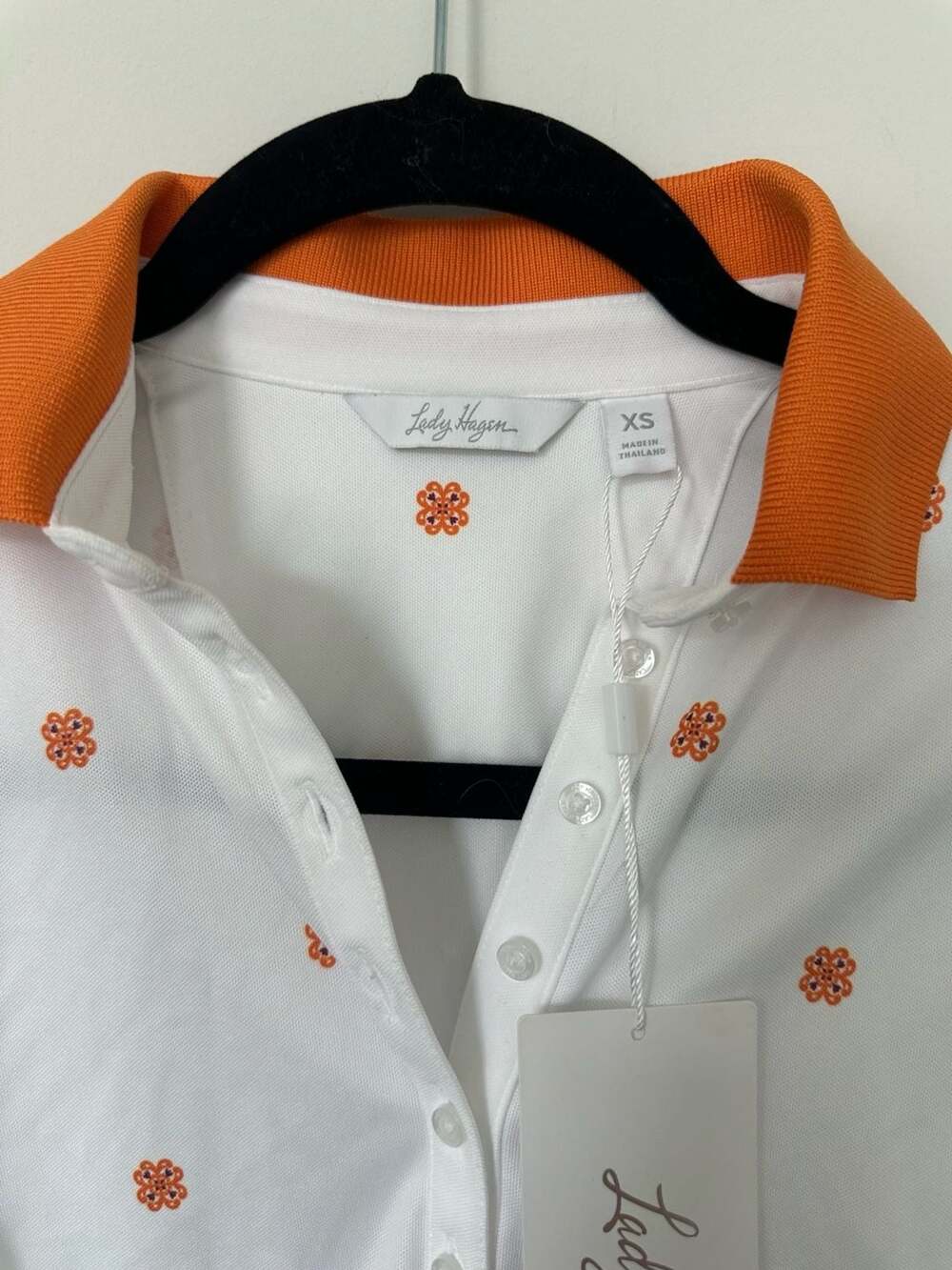 Lady Hagen Women's Sleeveless Golf Polo White with Orange Medallion Floral Print